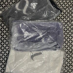 White black and purple nocta basketball t shirts